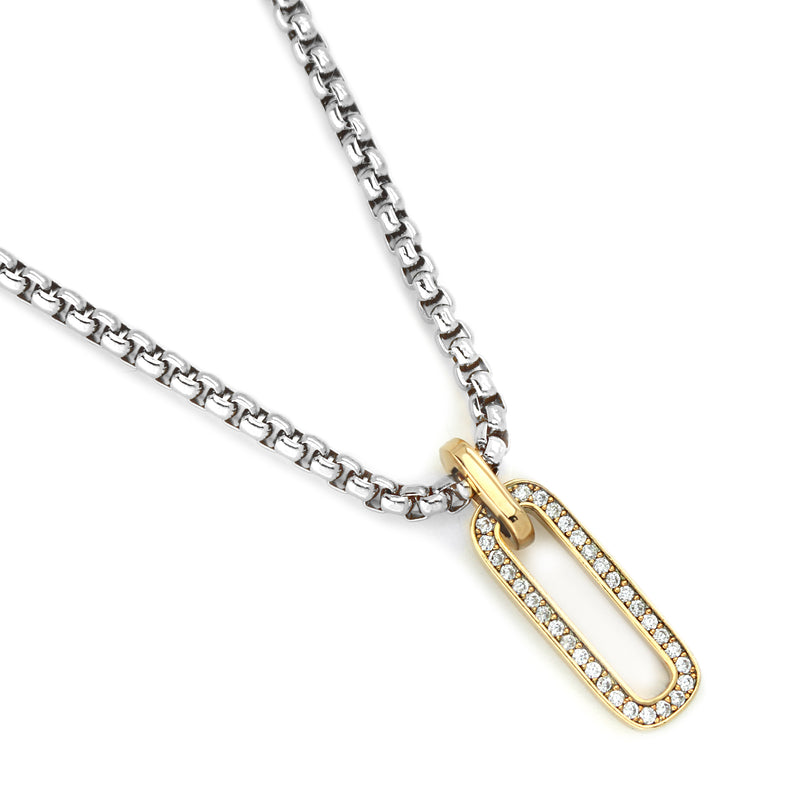 Oval shaped 18k gold plated and cubic zirconia charm and the stainless steel silver chain of the Procida Necklace.