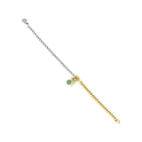 The RISTRETTO BLENDED BRACELET, which is a single two-tone bracelet combining silver and gold chains, features playful charm accents, including a green pavé circle and a gold-tone triangle. This unique piece is perfect for adding a touch of color and personality to any look.