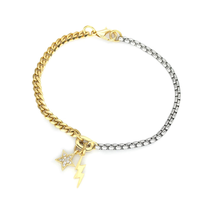 The SHAKERATO BLENDED BRACELET, which is a dual-tone bracelet featuring a mix of gold and silver chain links. This elegant piece is adorned with star and lightning bolt charms, accented with sparkling crystals, making it a bold and stylish accessory for any look.