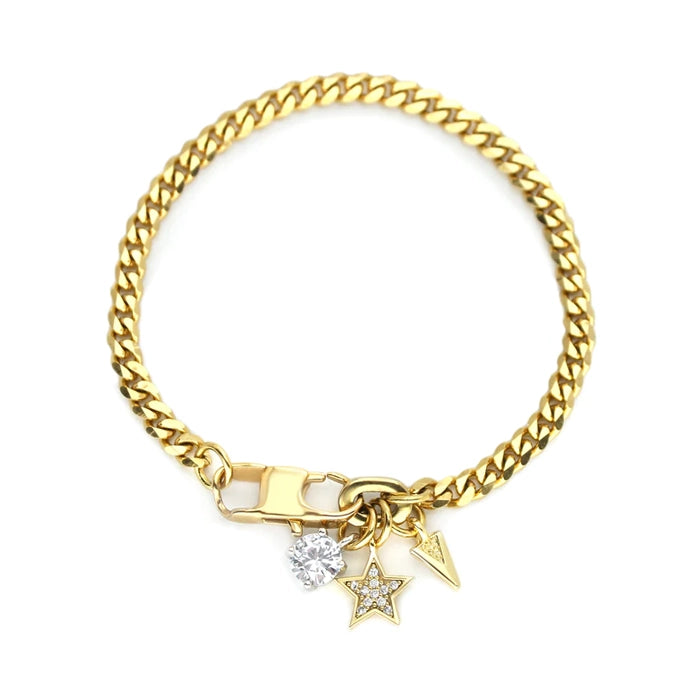 The Marocchino Blended Bracelet, which is a charming gold bracelet, features a classic chain design adorned with three delicate charms: a sparkling cubic zirconia, a star with crystal accents, and a pointed arrow charm. This single-piece bracelet combines elegance and playful detail, perfect for adding a unique touch to any wrist stack or as a standalone accessory.






