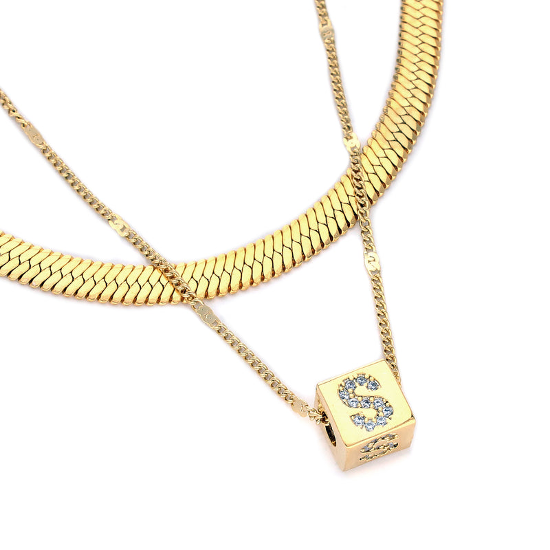 YOU & THE SNAKE necklace set which comes in 2 Chains, 18k Gold plated Stainless steel chain with a 7x10mm 24k Zirconia letter pendant.