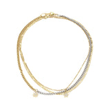 The Up High Necklace Set, a three-piece necklace set featuring gold and silver chains with star charms.