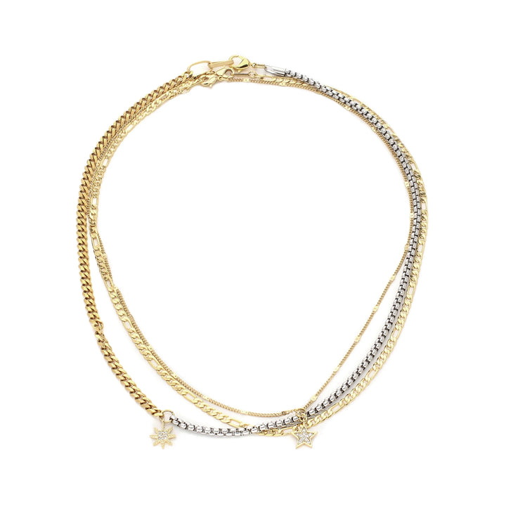 The Up High Necklace Set, a three-piece necklace set featuring gold and silver chains with star charms.