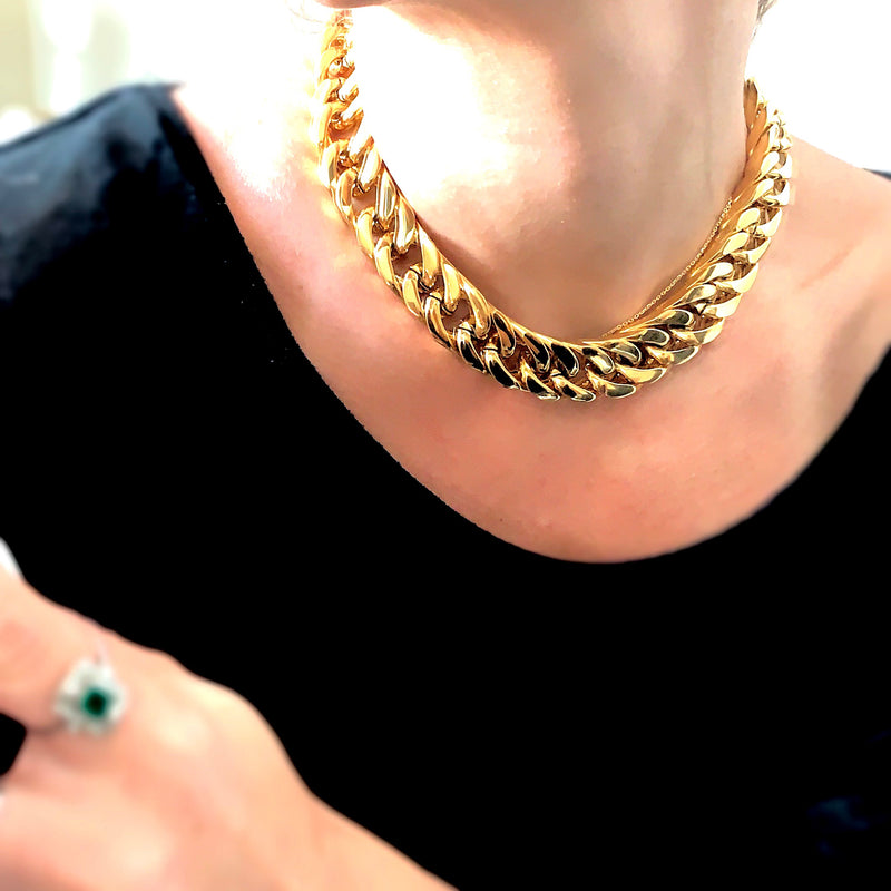 Model wearing a black top and the Gold Cleo Necklace which is 16" long, 18k gold plated stainless steel chunky chain.