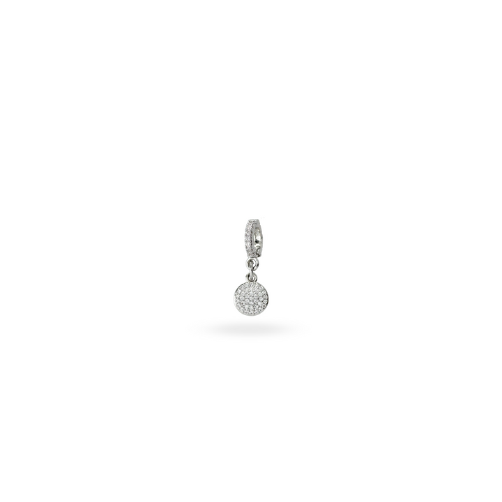 The Dot Clip On Charm, a silver charm with a circular design fully encrusted with sparkling diamonds and a silver clip-on bale. ||| SILVER