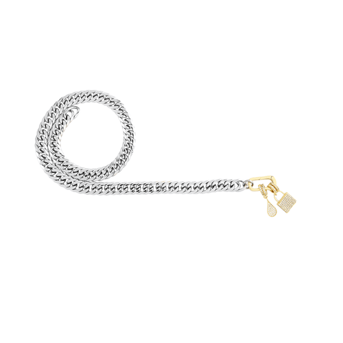 The Just Click Lock Chain, a silver chain with a gold lock charm accented with cubic zirconia and a dangling teardrop charm.