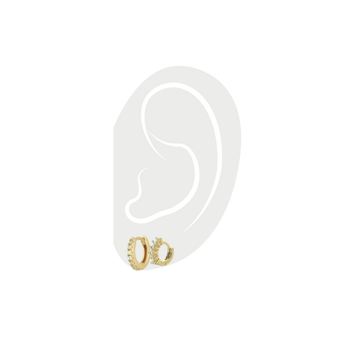 Photo of a tiny huggies earring and MINI CLEAR GOLD HUGGIES that are 18k gold plated with cubic zirconia. The two earrings are part of The ELBA EAR SET - 3 & 2 HOLES which comes with five earrings. 