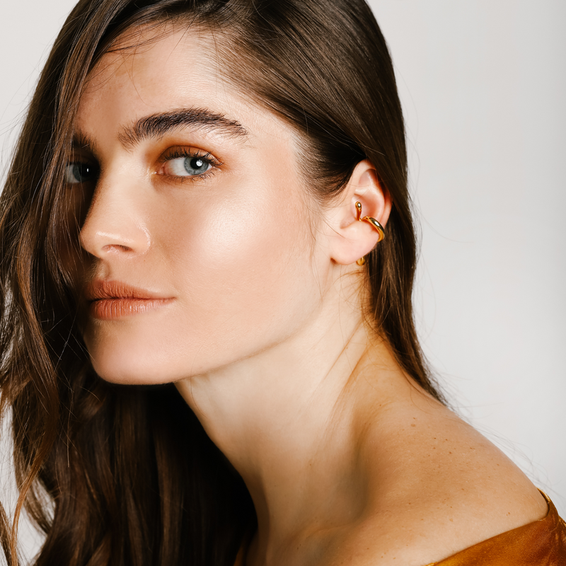 Model is wearing the SICILY EAR CUFF which is an 18k gold plated brass ear cuff.
