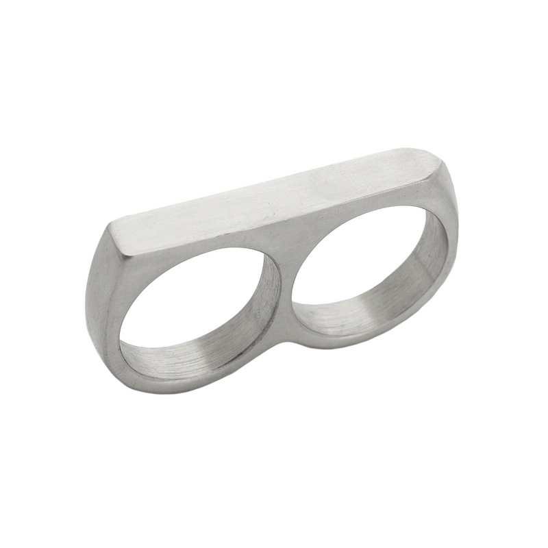 The FERVENT RING which is a double ring made of silver plated stainless steel. It has a flat surface covering two fingers when worn.