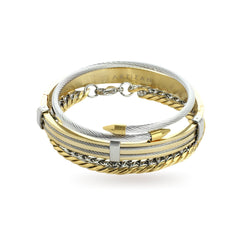 The Nekhamma Stack, a three-piece gold and silver bracelet stack featuring a bangle with the word "ARTIZAN," a bangle with textured detailing, and a chain bracelet with a spike-shaped accent.