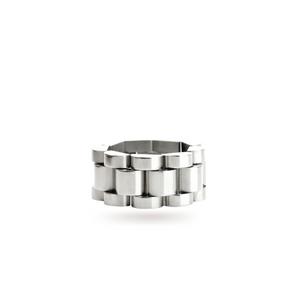 The Move Ring, a silver ring with a unique design resembling interlocking silver links.