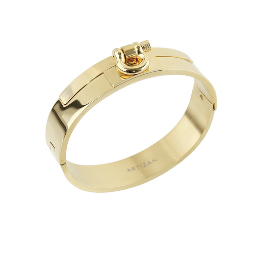 The Herradura Bangle, a gold and silver bangle bracelet with a prominent, horseshoe-shaped clasp. ||| GOLD
