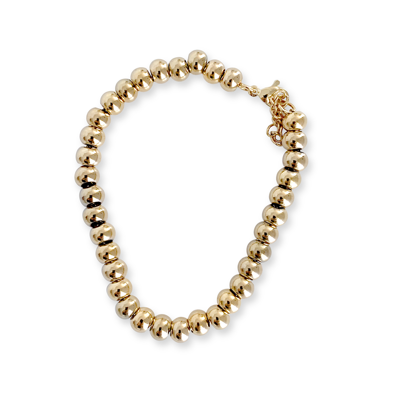THE PUNTITOS Gold Medium BRACELET which is made of gold plated stainless steel circle beads.