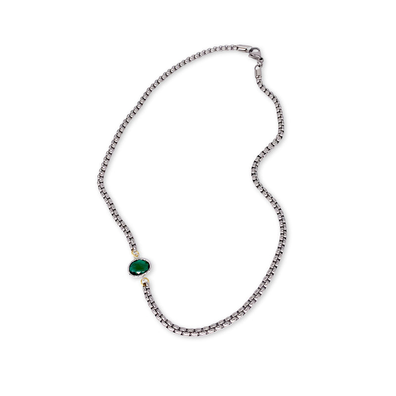 Emerald Point Silver which is a silver thin chain separated with a small green emerald stone.