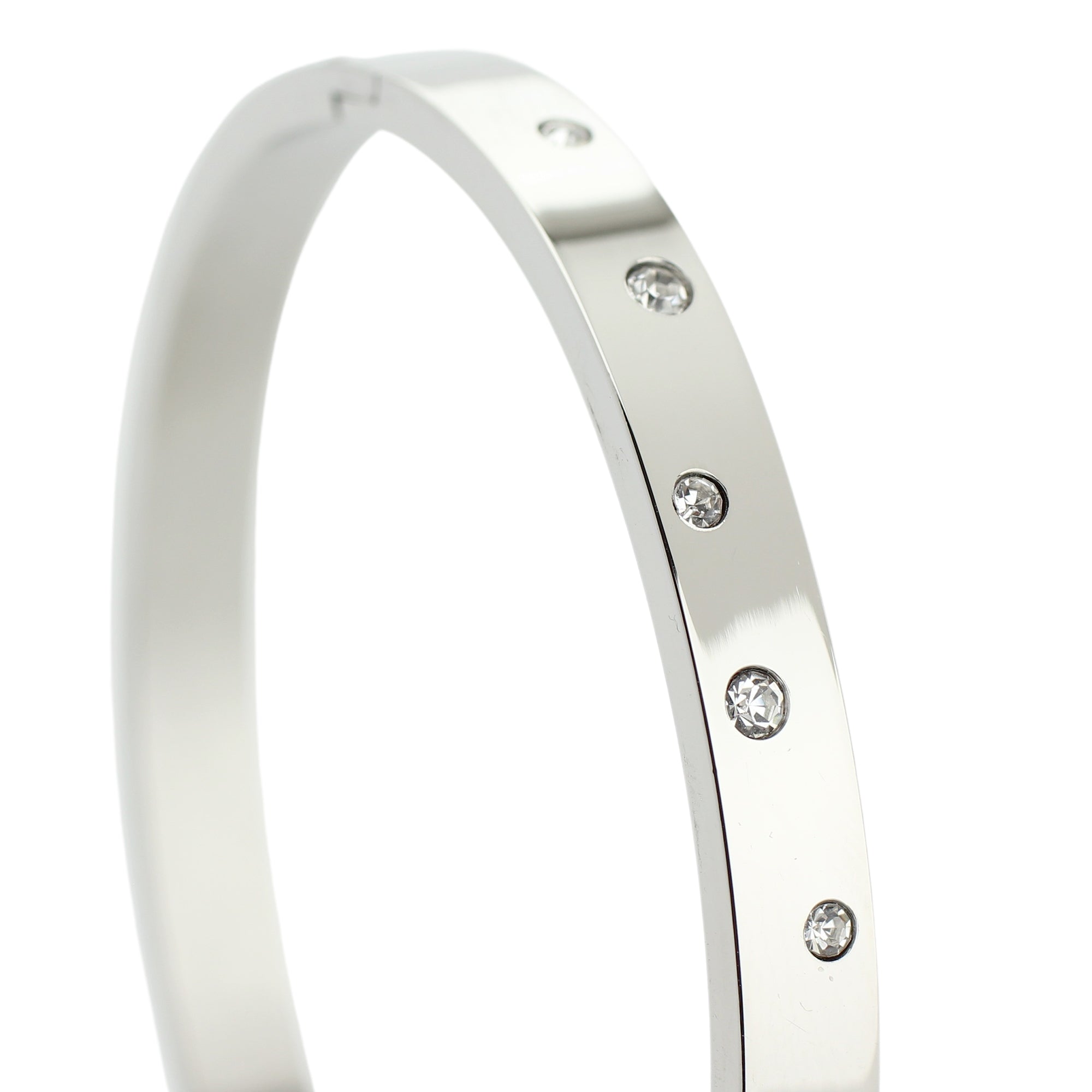 The BUBBLES BANGLE which is made of rhodium plated Stainless steel with encrusted zirconias around. ||| SILVER