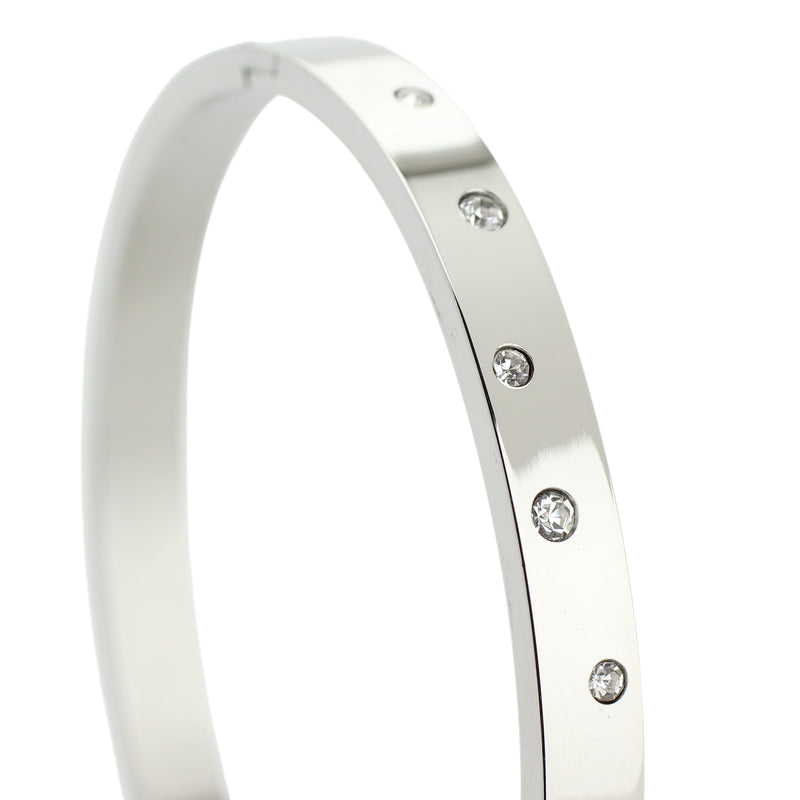 The BUBBLES BANGLE which is made of rhodium plated Stainless steel with encrusted zirconias around.