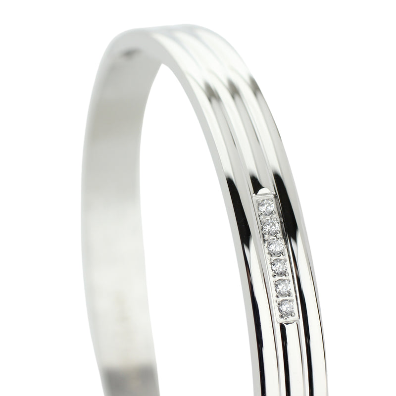 The LANE BANGLE which is made of rhodium plated stainless steel with six tiny cubic zirconia.