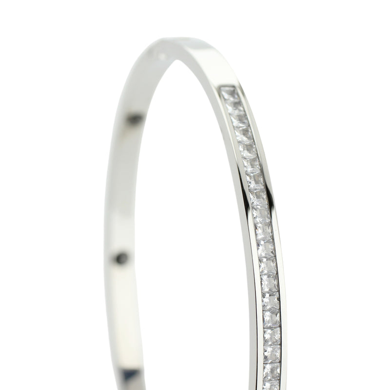 The DUST BANGLE which is made of rhodium plated Stainless steel thin bangle with encrusted tiny zirconias around.