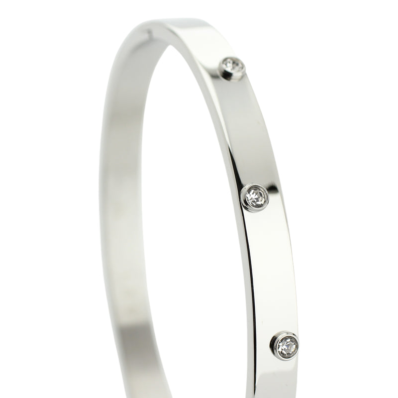 The ON BANGLE made of rhodium plated Stainless steel with embossed four cubic zirconia stones.