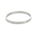The MIDDLE LANE BANGLE which is made of rhodium plated Stainless steel with six tiny Cubic zirconia and dimensions of 2.8" x 1.77".