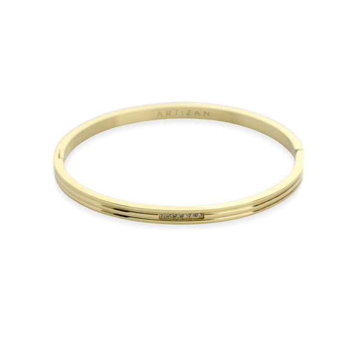 The Thin Bangle, a gold bangle bracelet with a minimalist design and a row of sparkling cubic zirconia stones. ||| GOLD