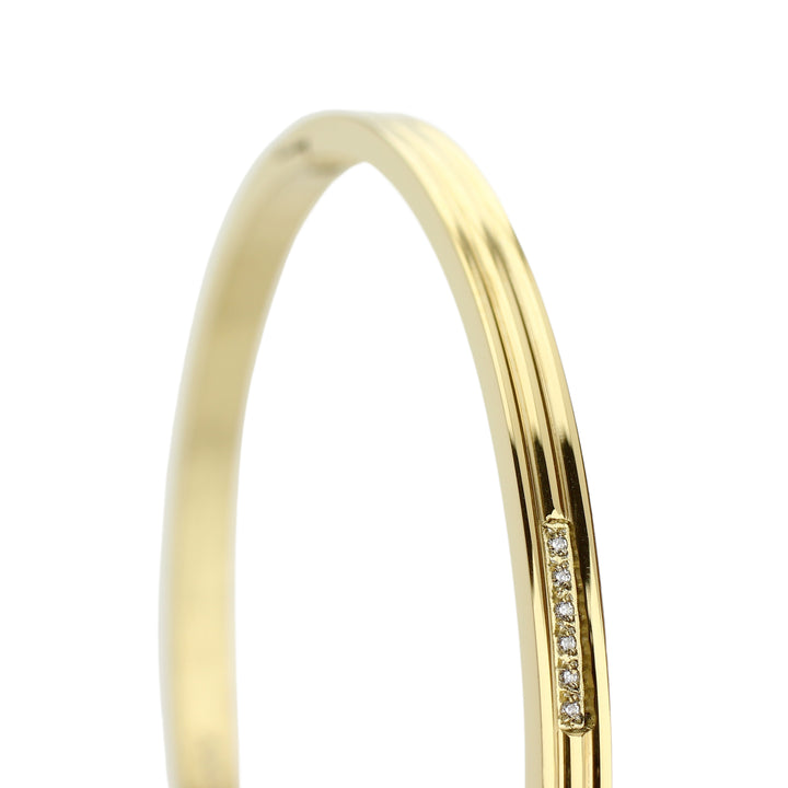 The THIN BANGLE which is made of gold plated Stainless steel with six tiny Cubic zirconia and dimensions of 2.8" x 1.77". ||| GOLD