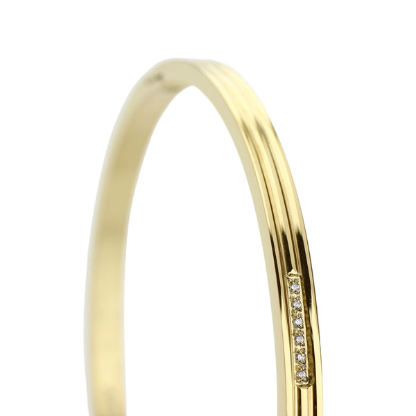 The THIN BANGLE which is made of gold plated Stainless steel with six tiny Cubic zirconia and dimensions of 2.8" x 1.77".