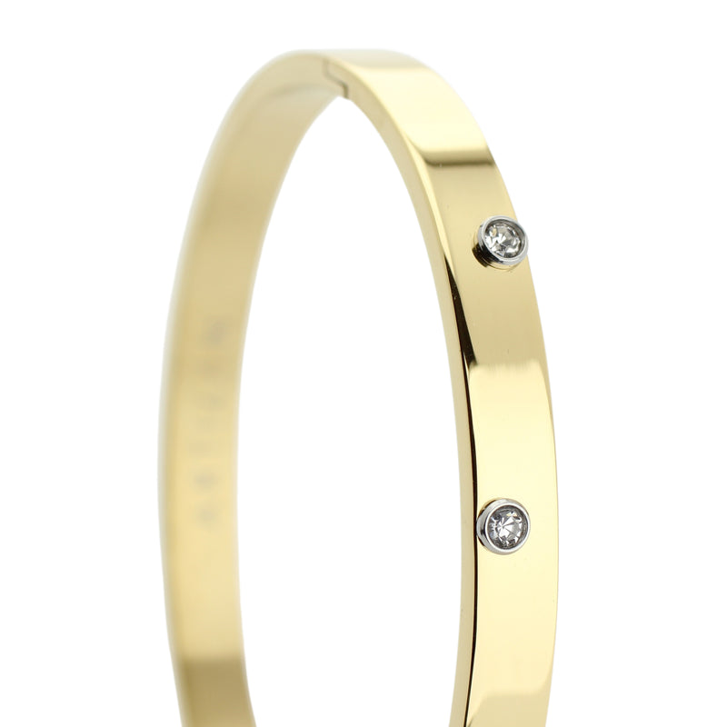The ON BANGLE made of gold plated Stainless steel with embossed four cubic zirconia stones.