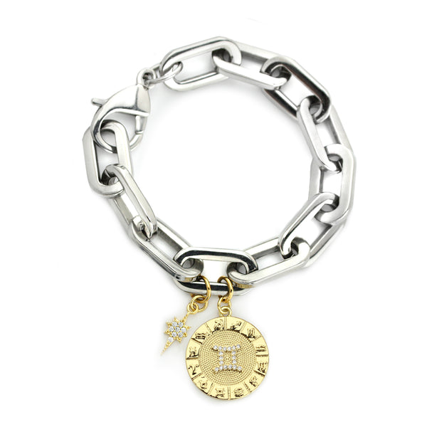 The ZODIAC PUERTO BRACELET- Gemini made of 8" Hypoallergenic Rhodium Plated Stainless Steel chain with 20mm Gold Filled Gemini Zodiac Charm with Micro Pave Constellation.