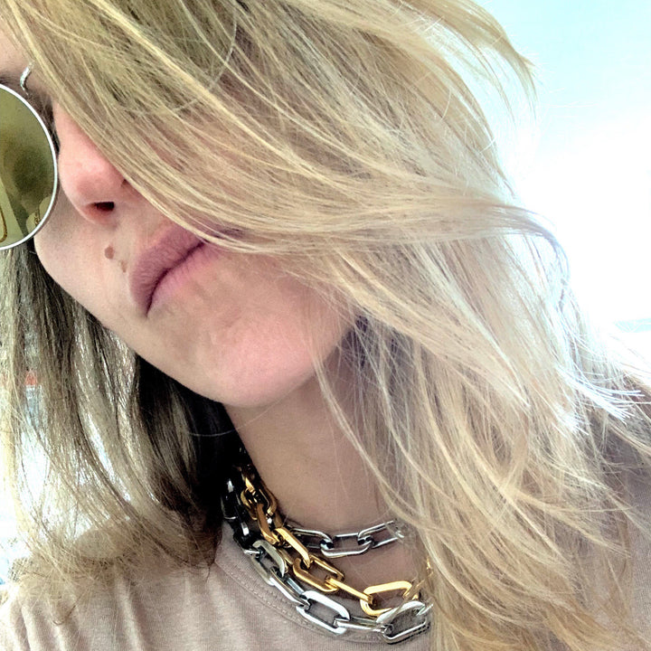 Model wearing 3 Puerto Chain Necklaces in Silver and Gold. ||| SILVER