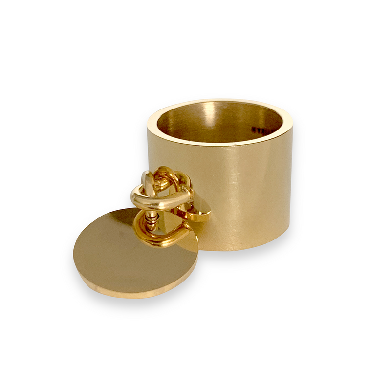 Coin Ring which is gold around one inch wide with a knob that has a coin charm hanging on it. 
