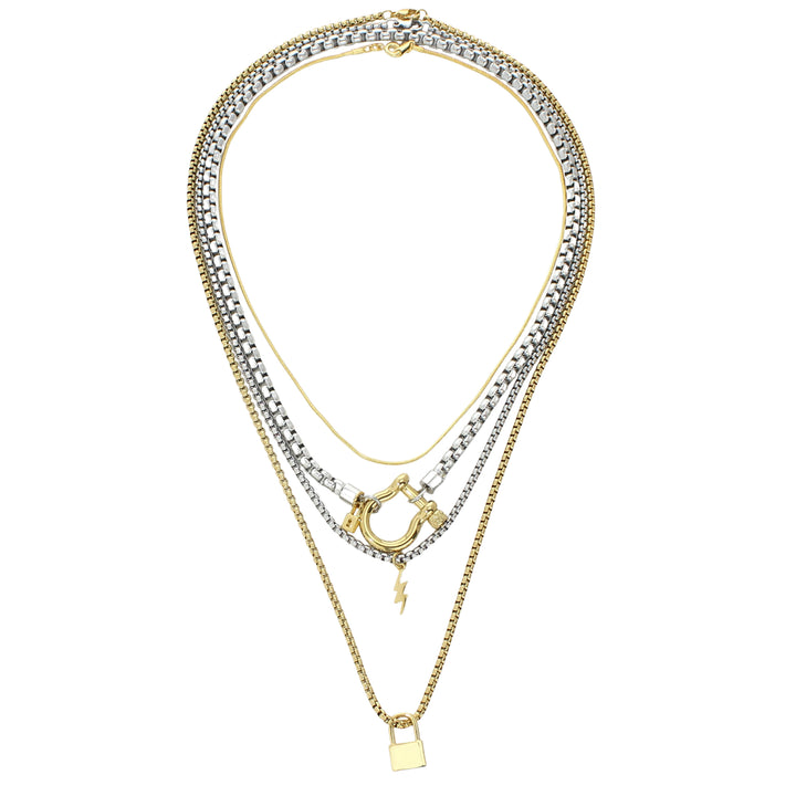 The Herradura Lock Layered Necklace Set, a four-piece silver and gold necklace set featuring a variety of chains with a gold horseshoe clasp, a lightning bolt charm, and a padlock charm. |||Gold