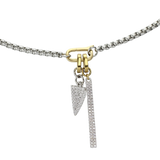 The can opener necklace with the Daga Link Charm, a sparkling silver charm featuring a spike shaped with dazzling array of diamonds and bar link charm.