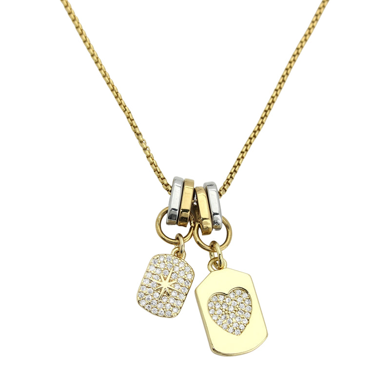 The DUO CHARM NECKLACE which is a Set of 2 separate chains made of 925 sterling silver 18K gold plated bold link chain that is 16" long and a 1mm wide gold plated chain that is 24" long with Dainty pave heart and star charms.