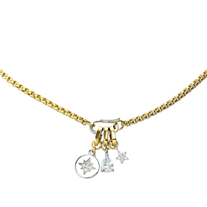 The can opener necklace featuring The MINI STAR LINK CHARM which is a  silver diamond encrusted star charm with gold link, the drop charm and round silver charm with north star diamond detail.