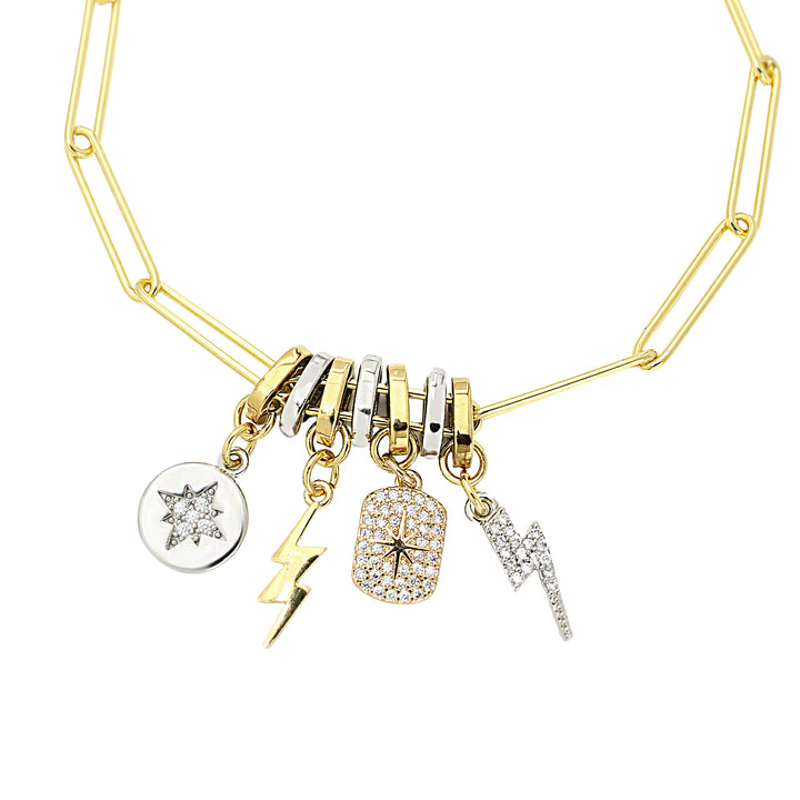 The LINK CHARM BRACELET which is 925 sterling silver 18K gold plated bold link chain with Dainty pave gold filled celestial star tag, lightning bolt charm and Silver north star charm.