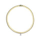 The Chic Snake Necklace, a gold necklace with a textured snake chain design and a single diamond-like stone pendant.