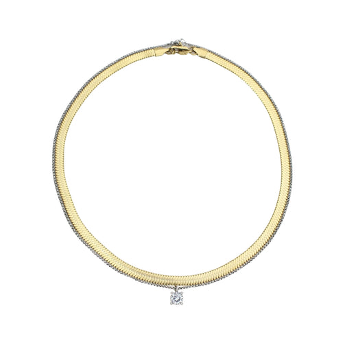 The Chic Snake Necklace, a gold necklace with a textured snake chain design and a single diamond-like stone pendant.