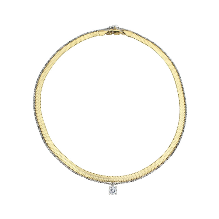 The Chic Snake Necklace, a gold necklace with a textured snake chain design and a single diamond-like stone pendant.