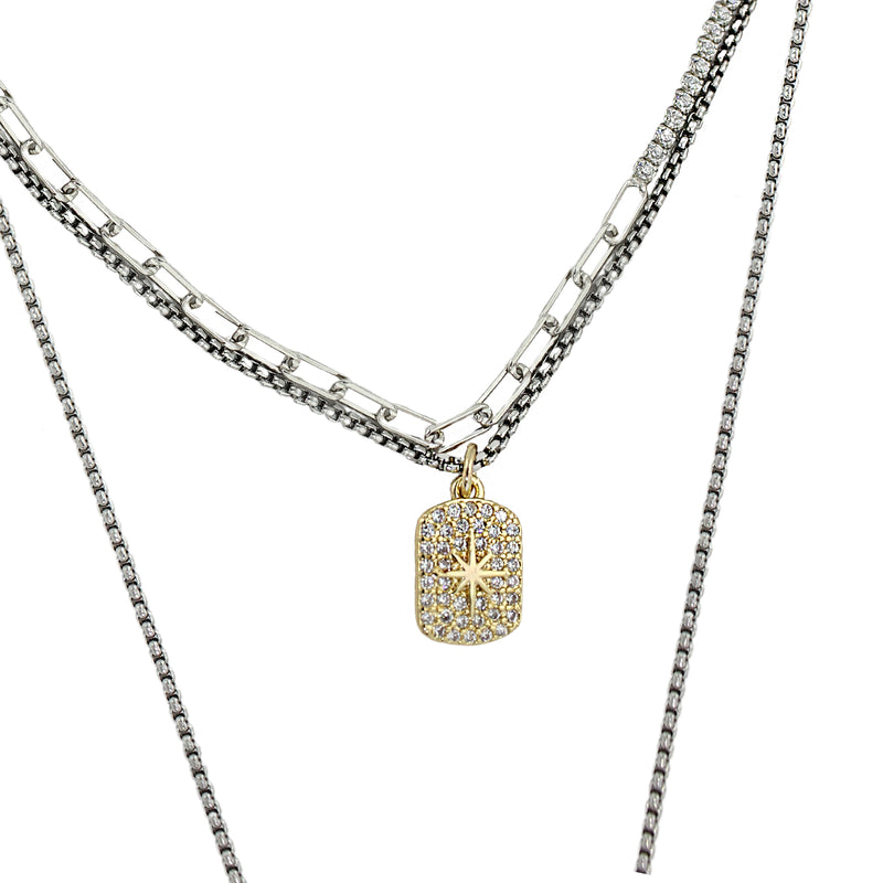Stainless steel Rhodium plated chain with a dainty gold filled northstar tag charm.