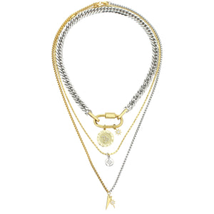 The Anne Zodiac Necklace which is a three pieces layered necklace set. Includes one silver chain with 18k gold plated carabiner and Gold Filled CAPRICORN Zodiac with Micro Pave Constellation charm, thin gold necklace with silver circle charm and another long necklace in half gold and silver with spike shaped charm and Gold Plated Micro Pave Studded Star.