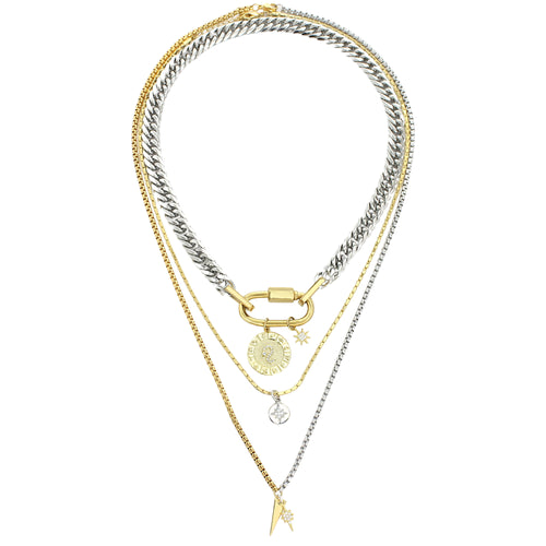 The Anne Zodiac Necklace which is a three pieces layered necklace set. Includes one silver chain with 18k gold plated carabiner and Gold Filled LEO Zodiac with Micro Pave Constellation charm, thin gold necklace with silver circle charm and another long necklace in half gold and silver with spike shaped charm and Gold Plated Micro Pave Studded Star.