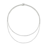 The Tennis Dainty Necklace Set, a two-piece silver necklace set featuring two diamond-like tennis necklaces.

