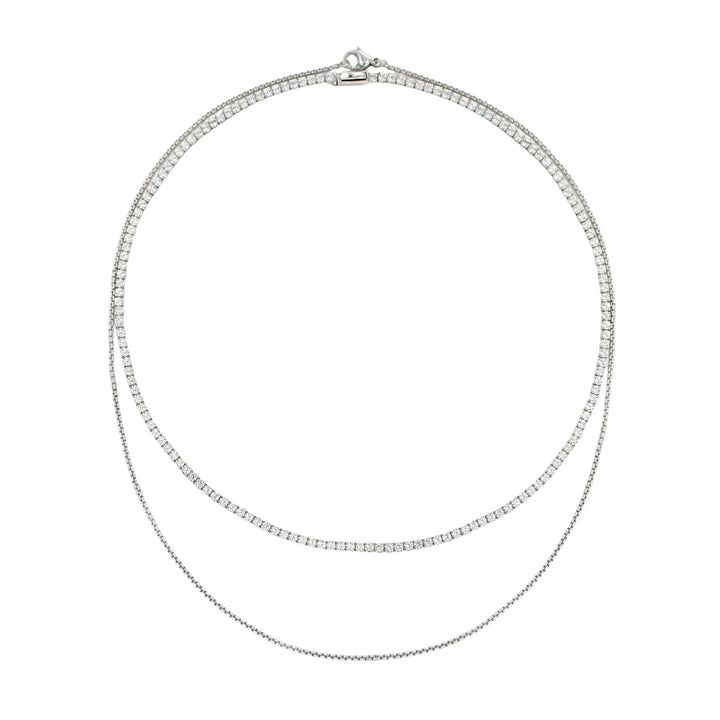 The Tennis Dainty Necklace Set, a two-piece silver necklace set featuring two diamond-like tennis necklaces.

