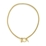 The Herradura Spike Necklace, a gold necklace with a spike charm and a unique horseshoe clasp.
