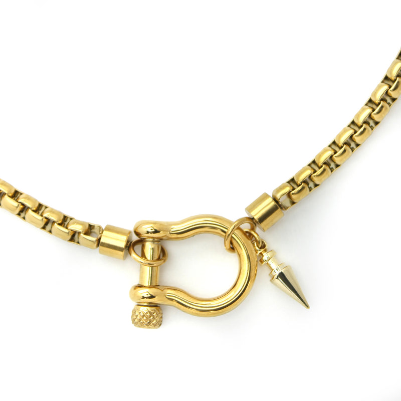Herradura Spike Necklace which is made of 18k gold plated non tarnish stainless steel chain with gold horseshoe clasp and spike pendant.