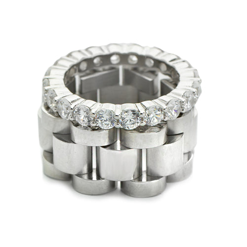 The synergy ring set includes 2 rings. One is the Eternity Ring which is made of 925 sterling silver dainty ring and the Move ring  which is a Stainless steel chain ring.