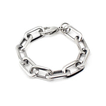 The Puerto Chain Bracelet, a silver chain bracelet with a unique elongated link design and a secure clasp closure.