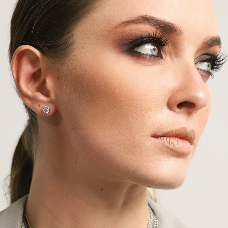 Model wearing one of the BRIGHT DOBLE SOLITAIRE EARRING. It comes in a set of 3 individual earrings. Each earring is made of 925 sterling silver with 0.3ct- 0.5ct Zirconia diamond Stud. 