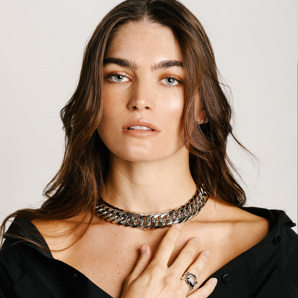 Model is wearing the SORRENTO NECKLACE which is a 16" long necklace and has a width of 22mm, stainless steel chunky chain. She is also wearing a silver Maxi Ring.
